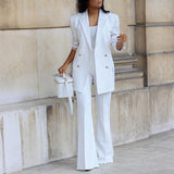 Longline blazer and flared trouser suit set in white, front view