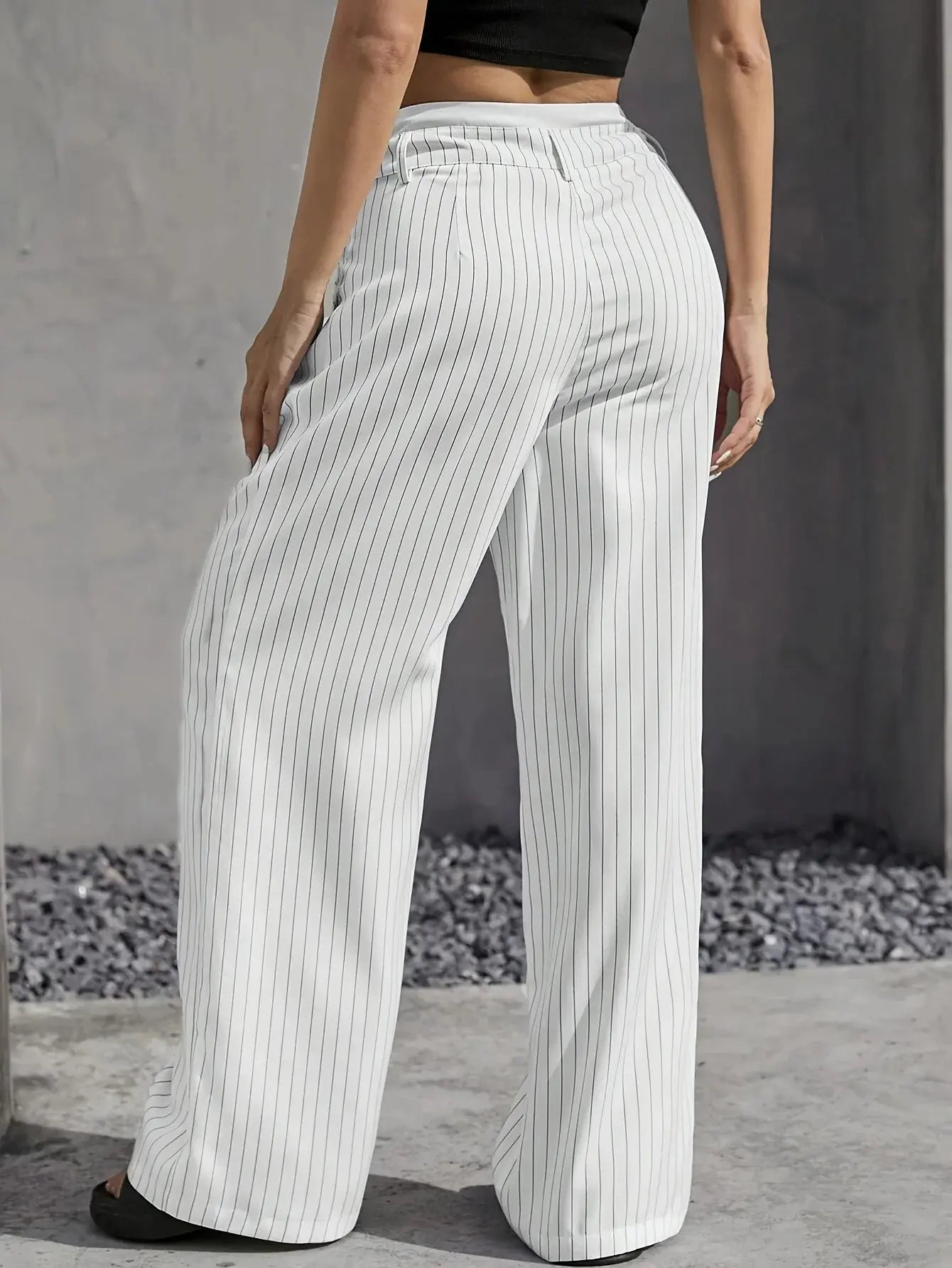 High-waist striped trousers, close detail