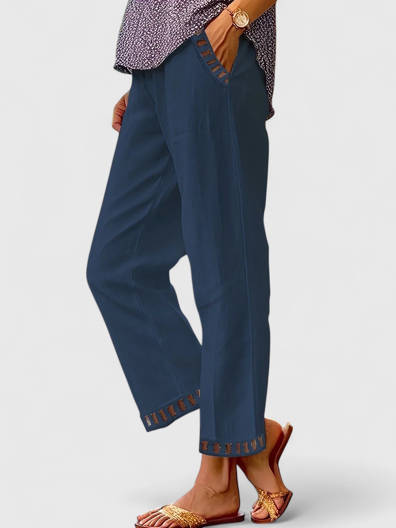 Cropped trousers showing contrast trim detail