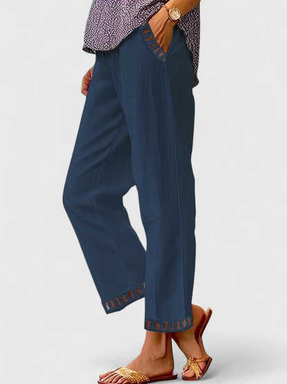 Cropped trousers showing contrast trim detail