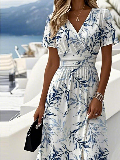 Printed midi dress showing V-neck and short sleeves
