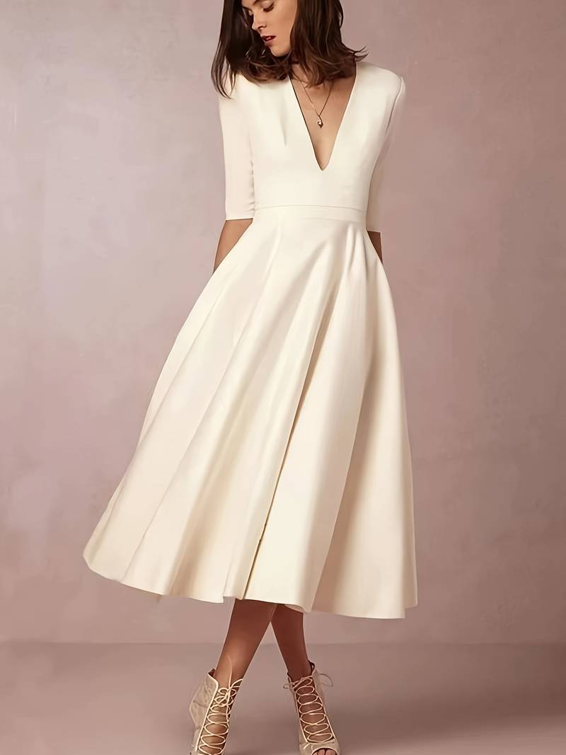 Flared midi dress showing tailored bodice