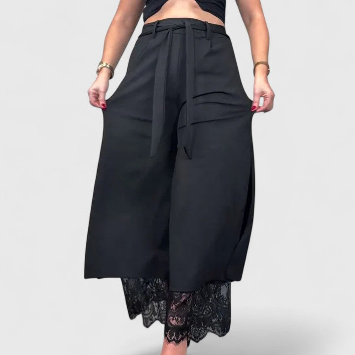 Wide-leg trousers with lace accent in black, front view