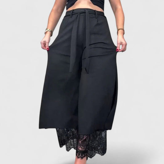 Wide-leg trousers with lace accent in black, front view