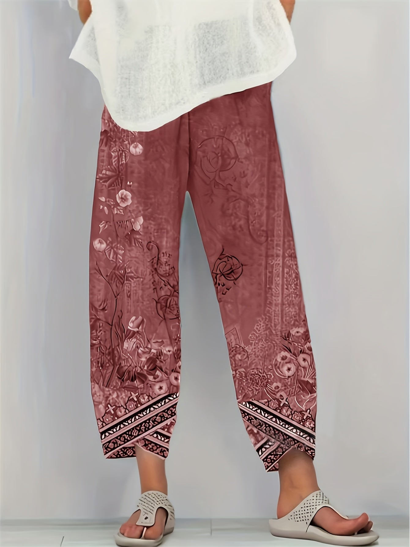 Cropped trousers in black botanical print colourway