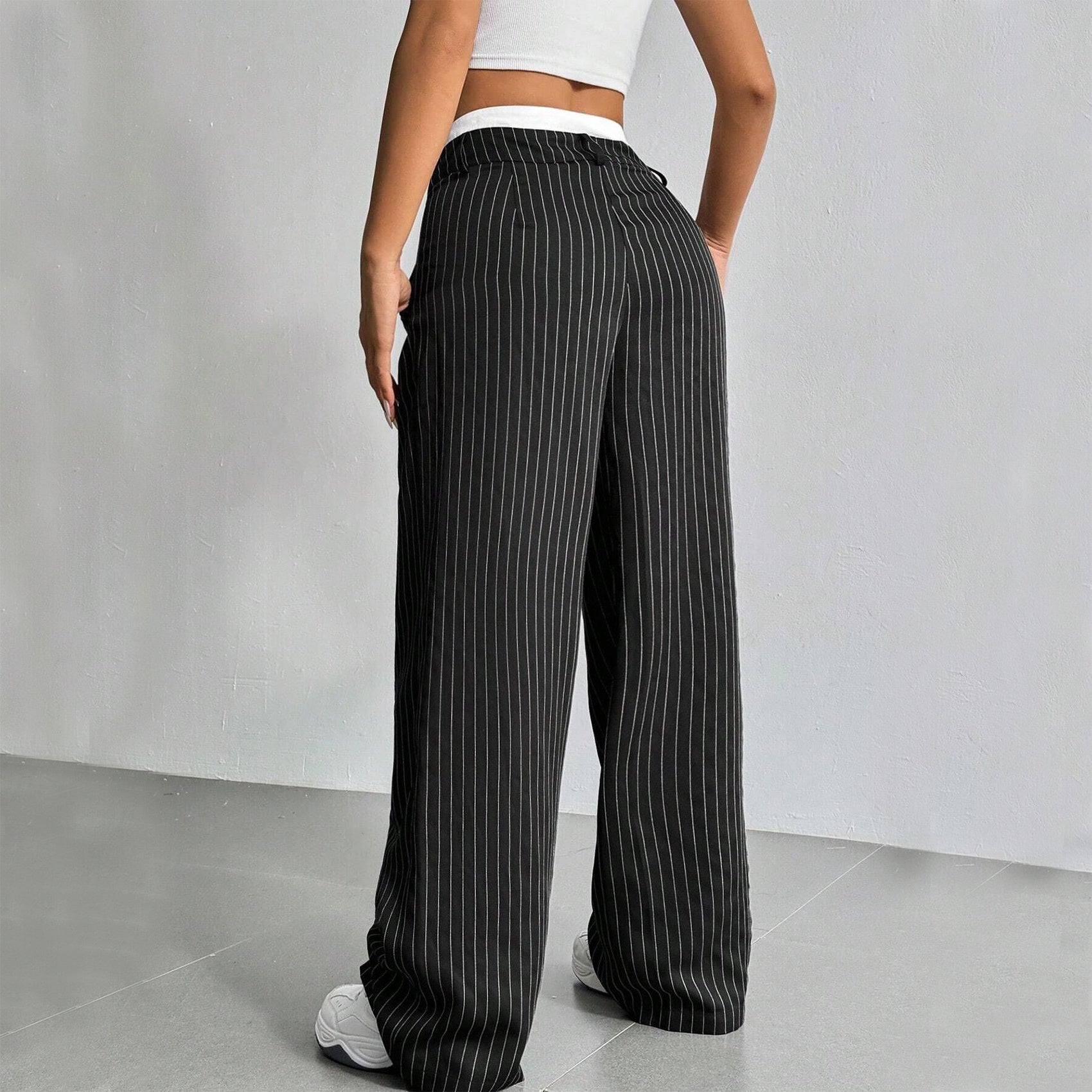 High-waist striped trousers in black colourway