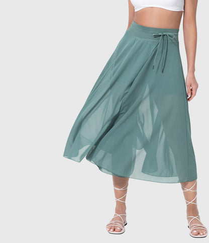 Pleated midi skirt showing fluid drape and pressed pleats