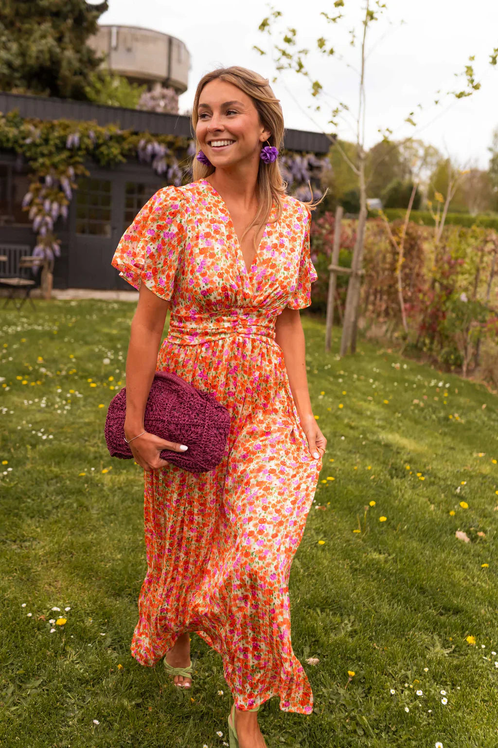 Floral maxi dress showing fitted waist