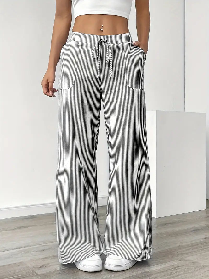 Striped trousers showing wide-leg cut