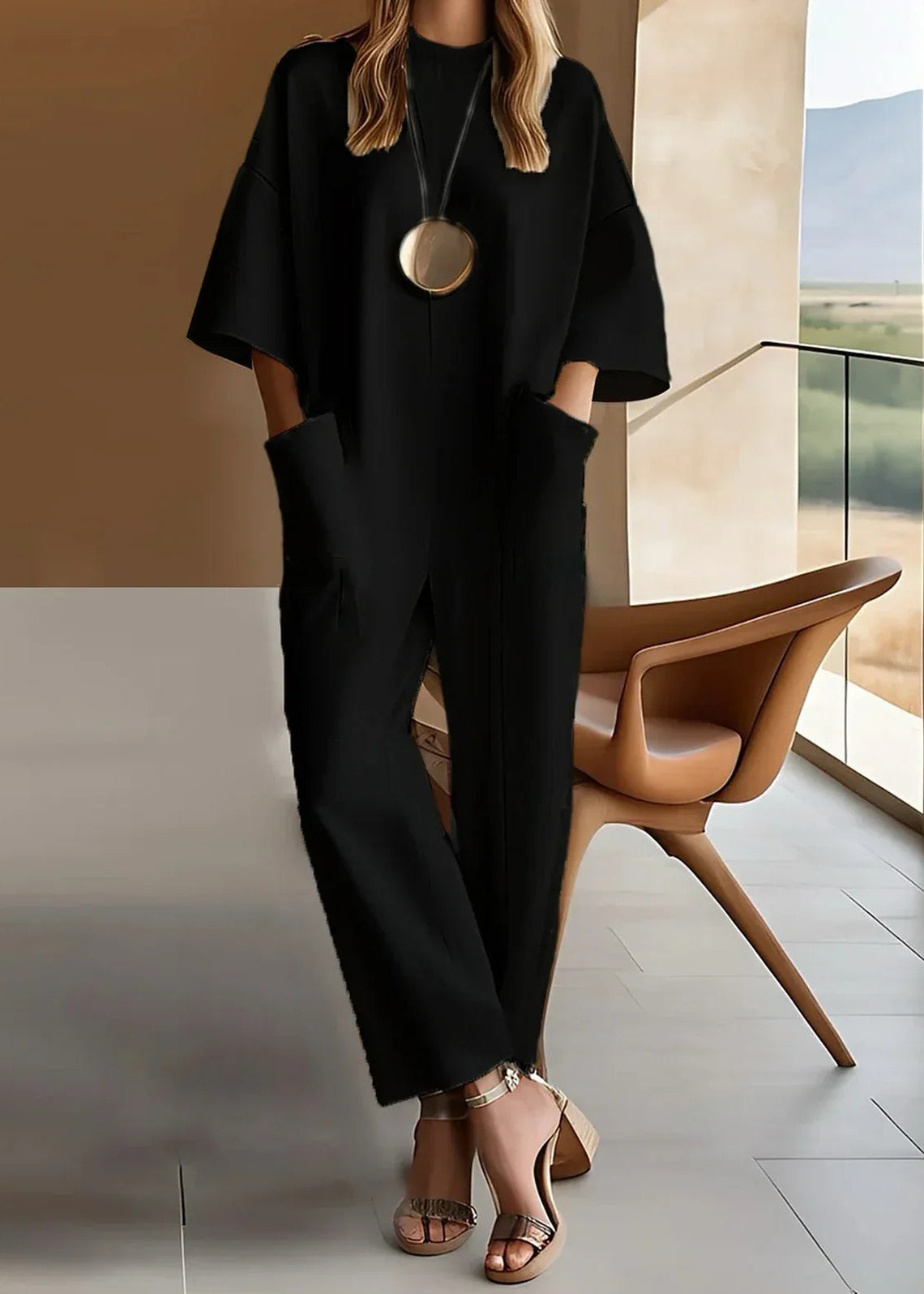 Short-sleeve jumpsuit in black colourway, full-length view