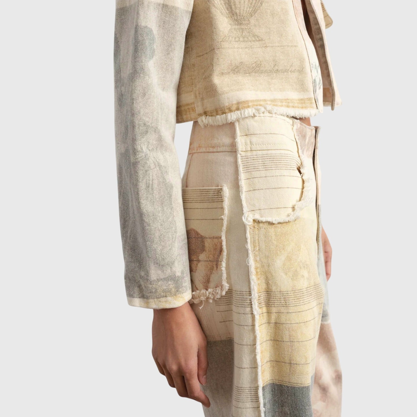 Wide-leg jeans showing raw-cut hem