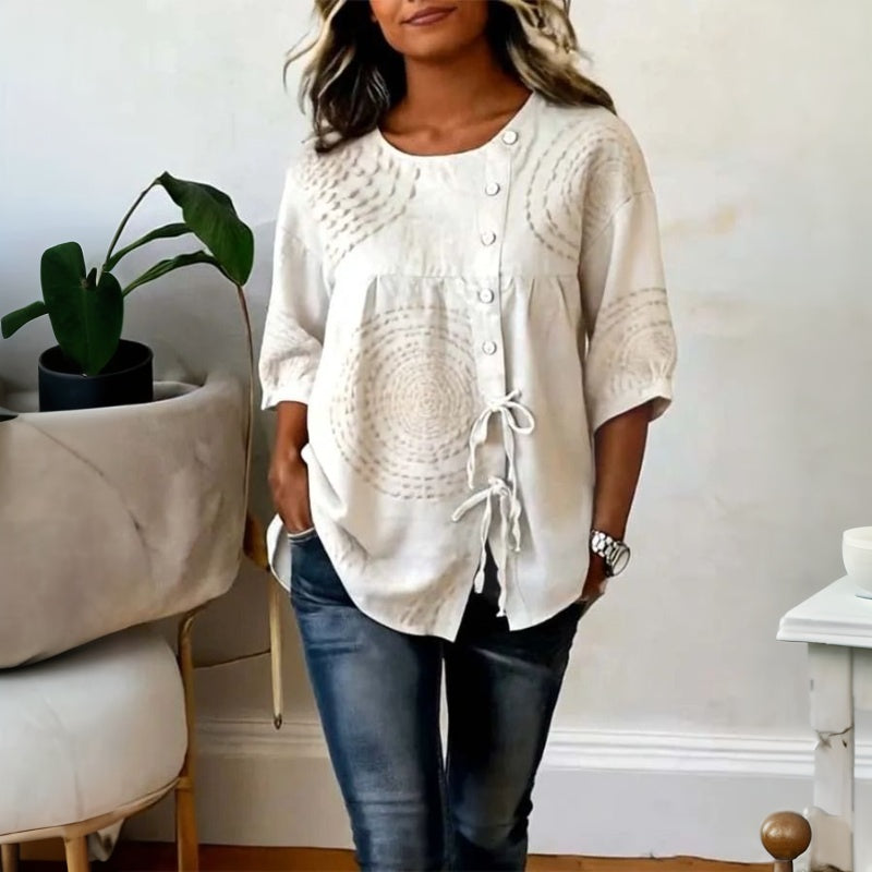 Relaxed embroidered top styled with trousers