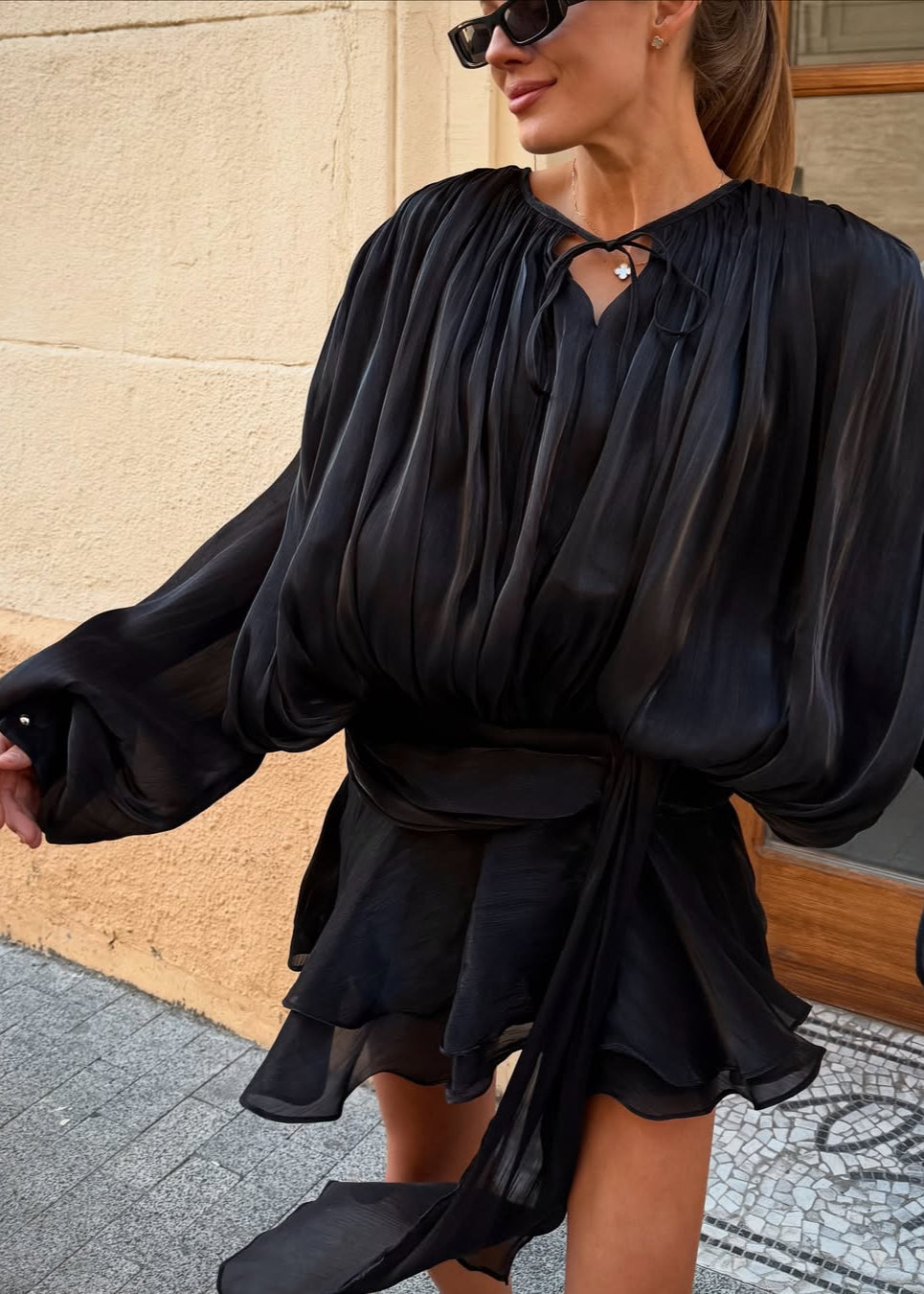 Estée black pleated long sleeve mini dress front view