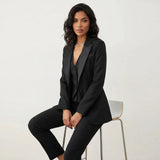 Three-piece blazer, vest and trouser suit in black, front view