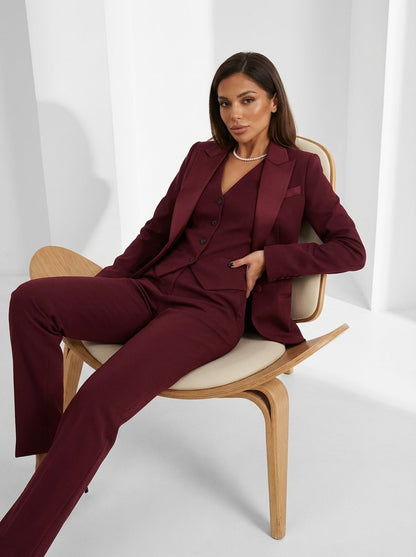 Black three-piece suit showing button-front vest