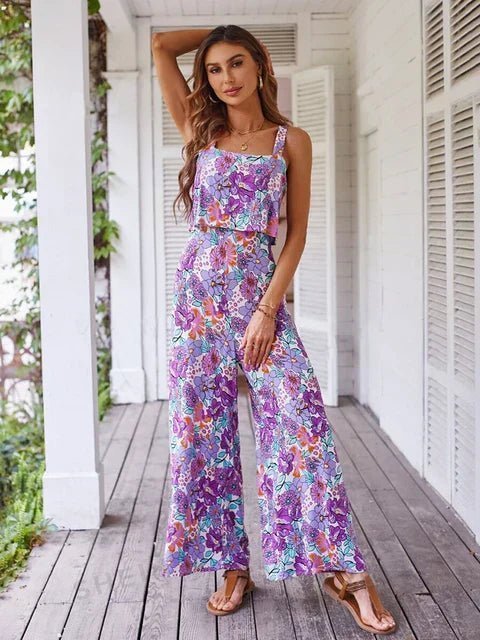 Sleeveless floral jumpsuit showing wide-leg drape