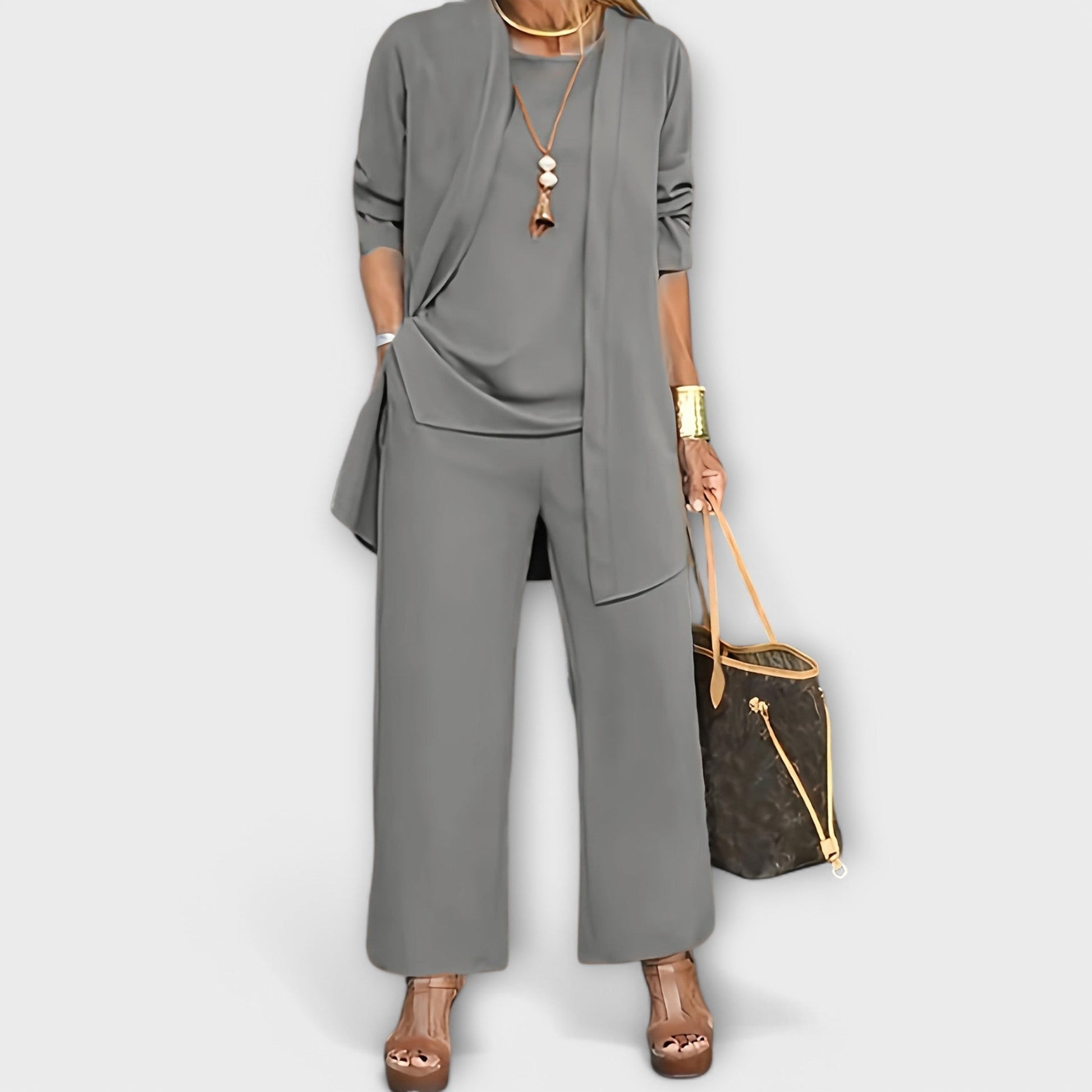 Longline duster cardigan over coordinated top and trousers