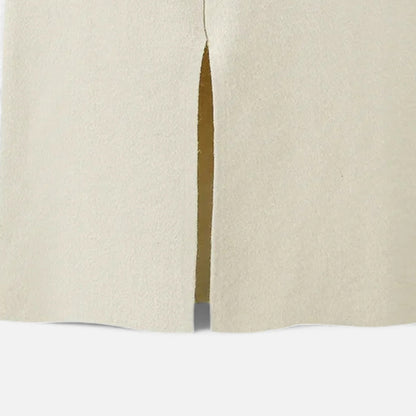 High-waist wool skirt styled with knitwear