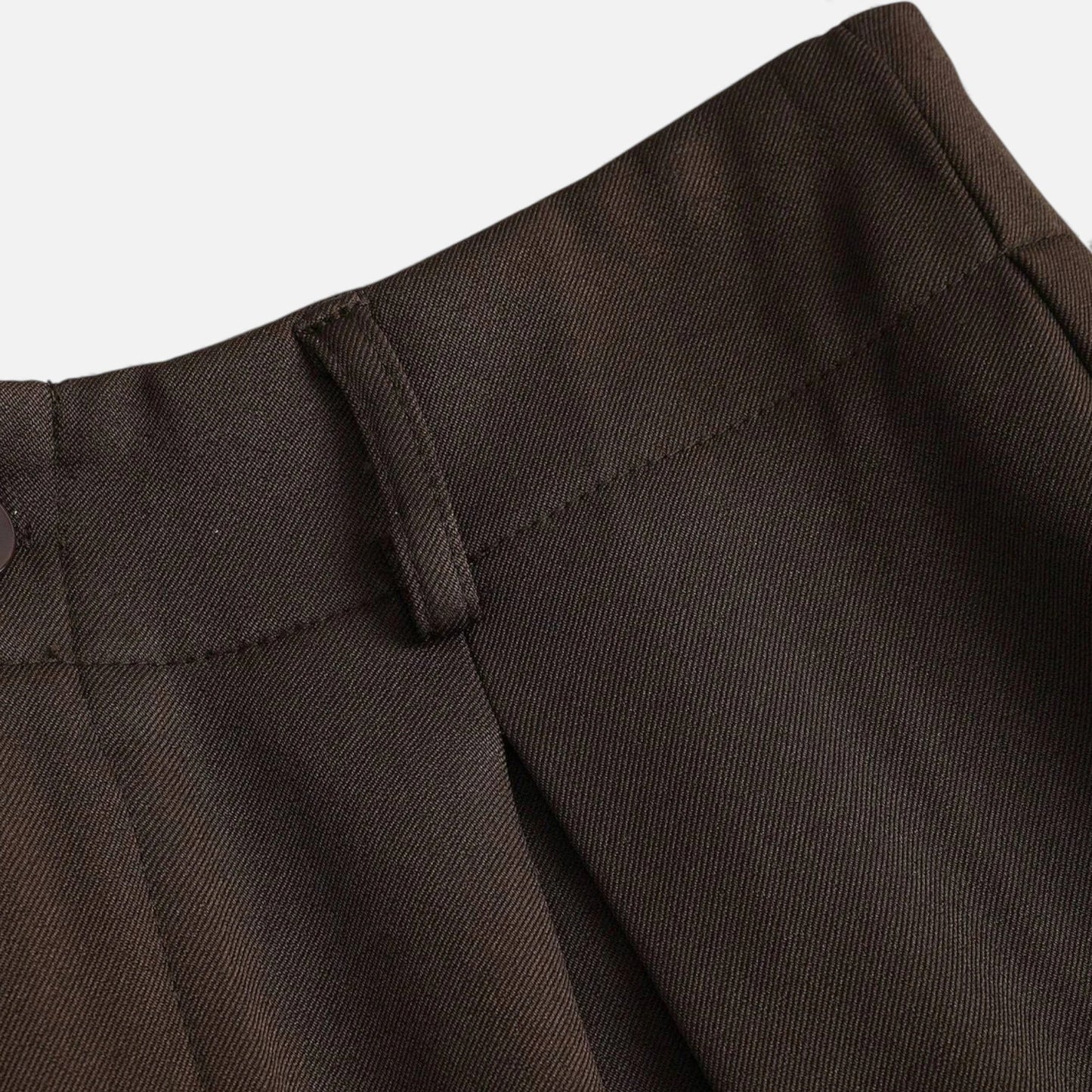 Wide-leg pleated trousers styled for autumn