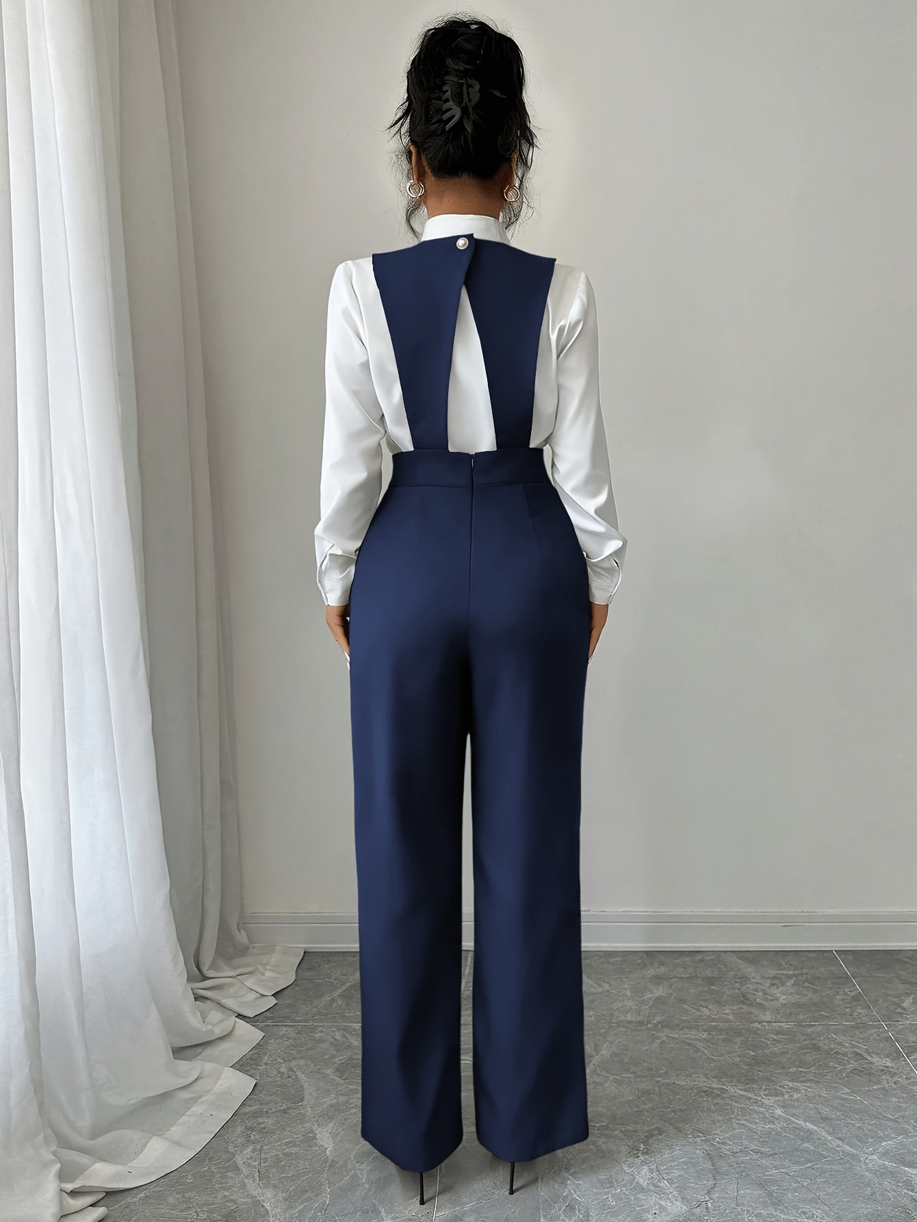 Jumpsuit showing subtle button run detail