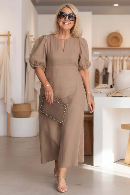 Midi dress showing gathered puff sleeve detail