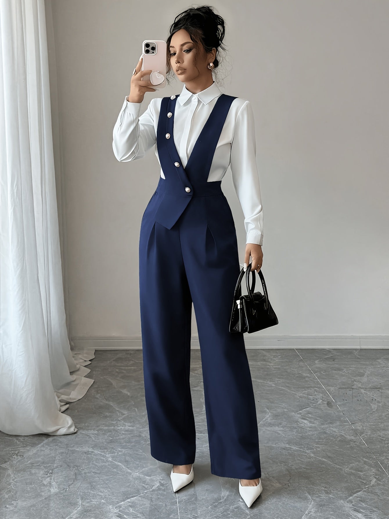 Wide-leg jumpsuit showing high waist and button detail