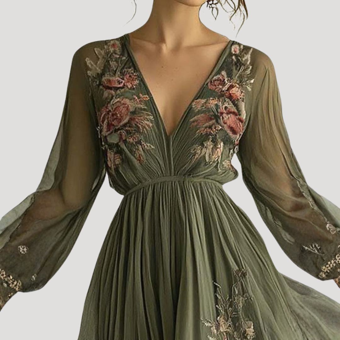 Embroidered maxi dress showing floral detail and empire waist