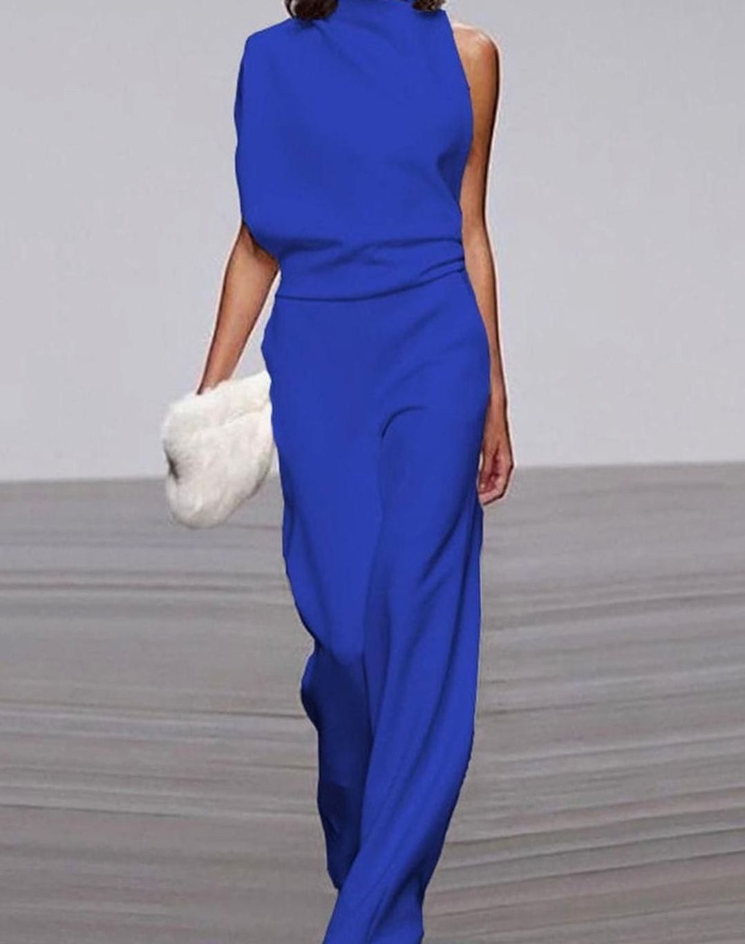 Asymmetric high-neck wide-leg formal jumpsuit, close-up of the neckline