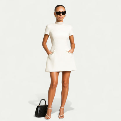 Pearl trim cocktail mini dress with pockets, close-up of the neckline