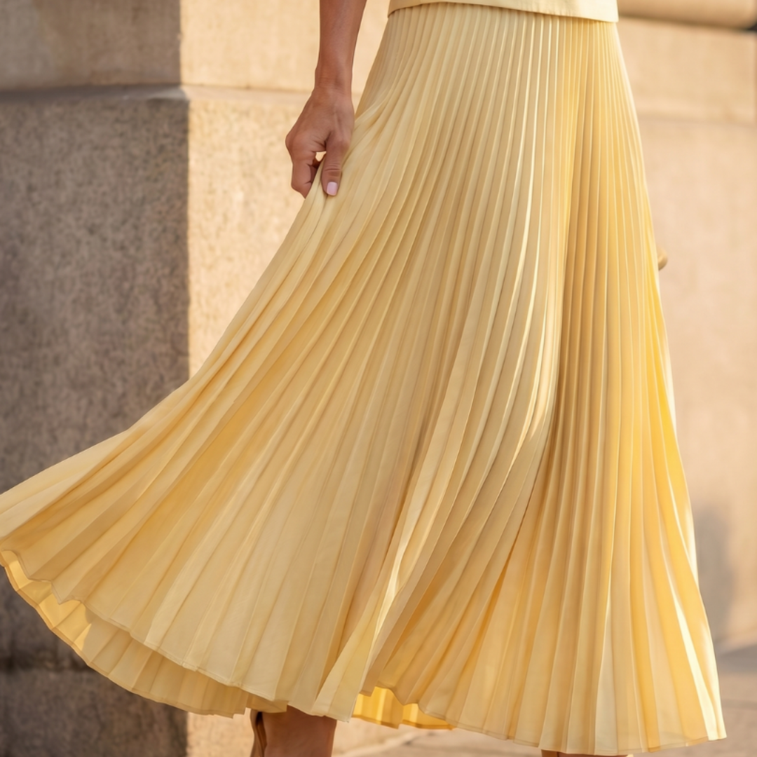 Sleeveless peplum top and pleated maxi skirt set, detail of the skirt