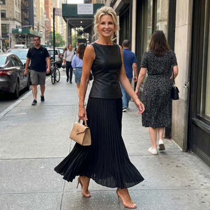 Sleeveless peplum top and pleated maxi skirt set, full-length view