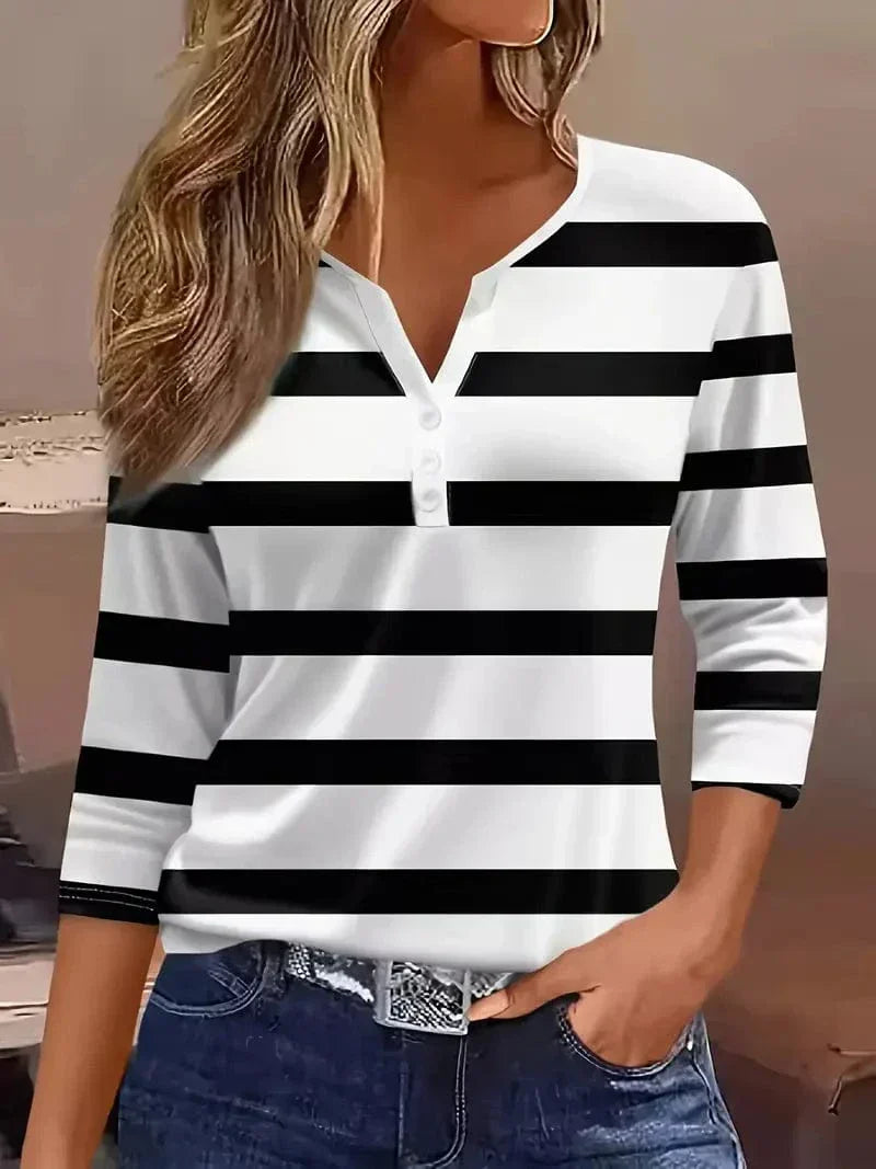 Striped V-neck top showing three-quarter sleeves