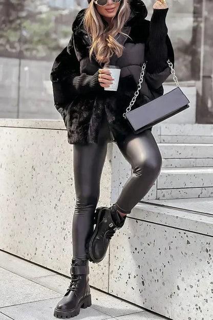 Hooded oversized puffer jacket with faux fur in black, styled view