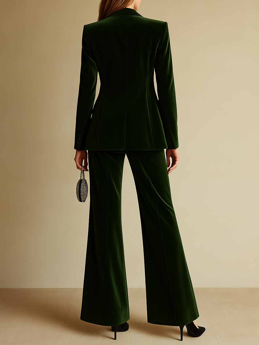 Emerald velvet shawl collar blazer and flare trouser suit, side view