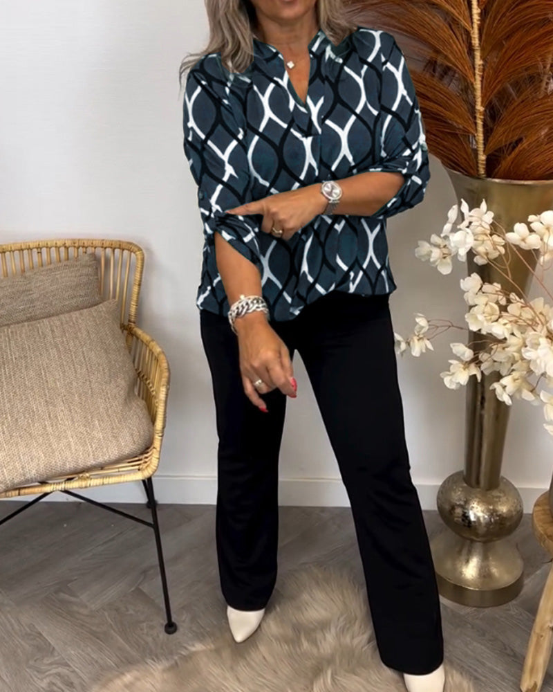 Long sleeve geometric print blouse, close-up of the fabric