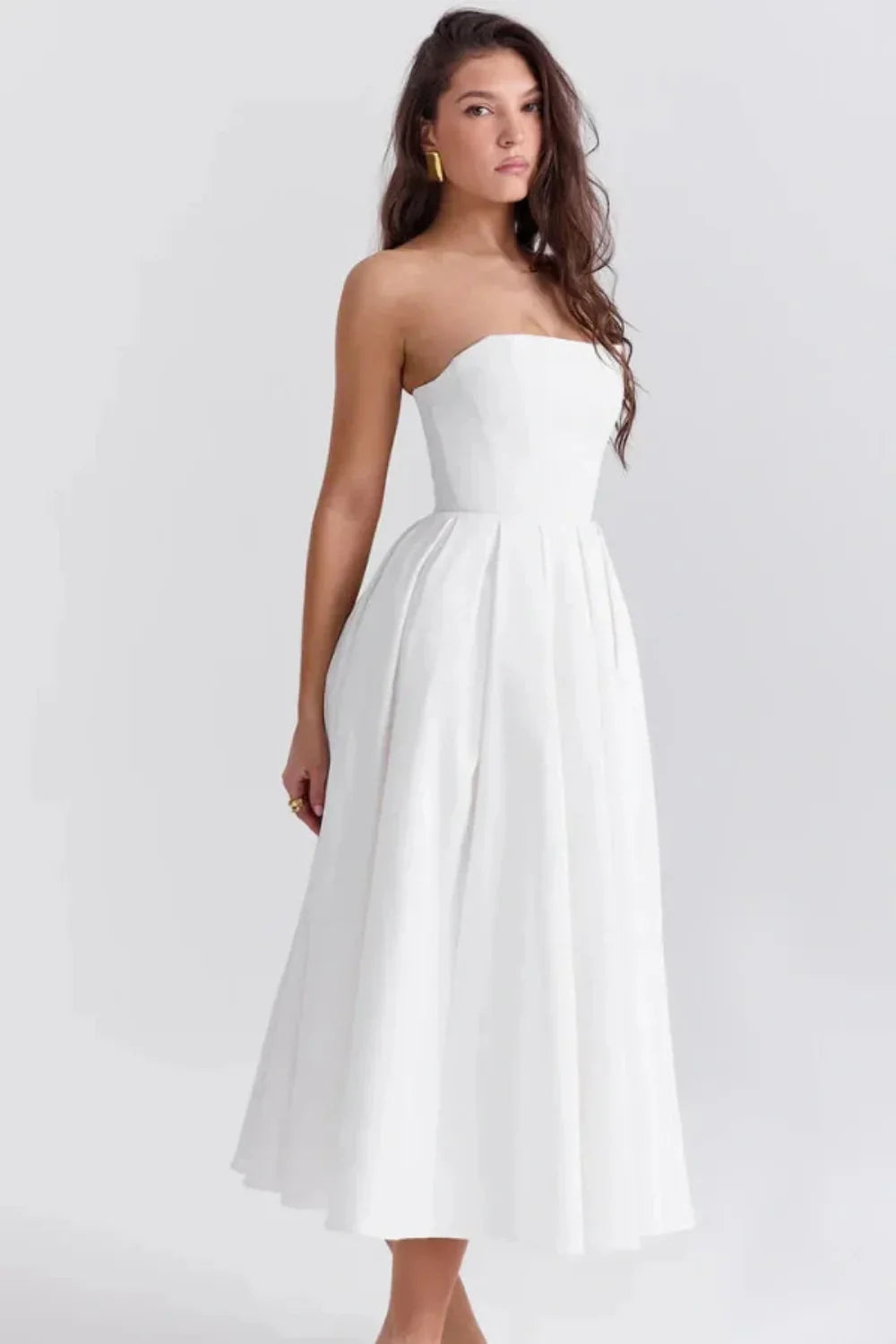 White strapless midi dress, side view showing pleated skirt
