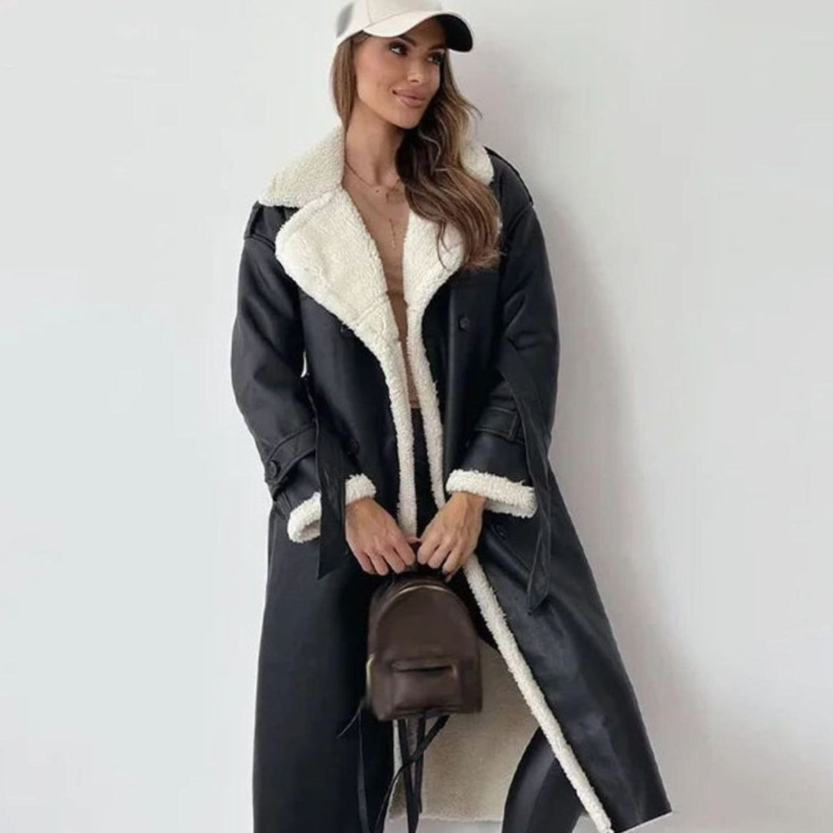 Long double-breasted faux shearling winter coat, side view