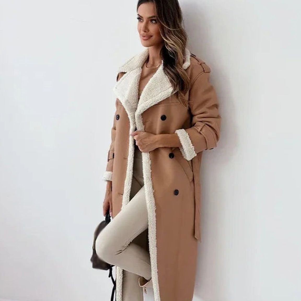 Long double-breasted faux shearling winter coat, close-up of the collar
