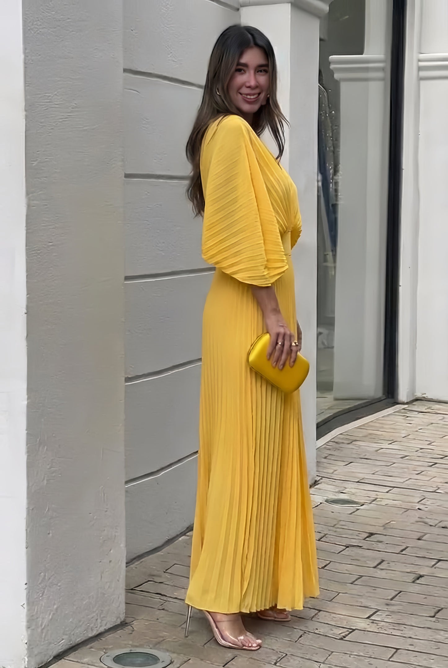 Maxi gown showing pleated skirt detail