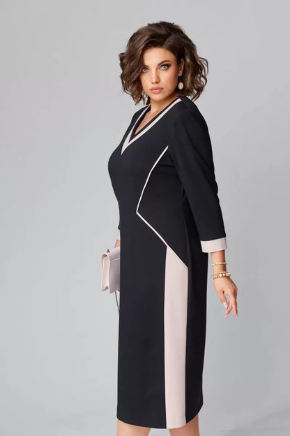 Navy midi gown showing contrast neckline piping