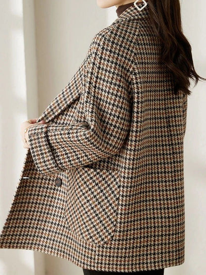 Double-breasted houndstooth blazer coat, close-up of the collar