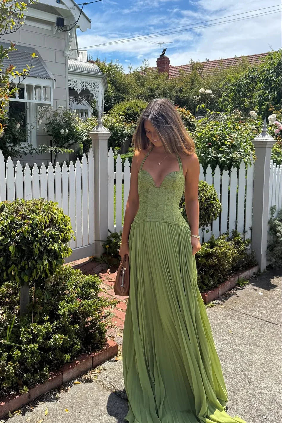 Green pleated maxi dress front view