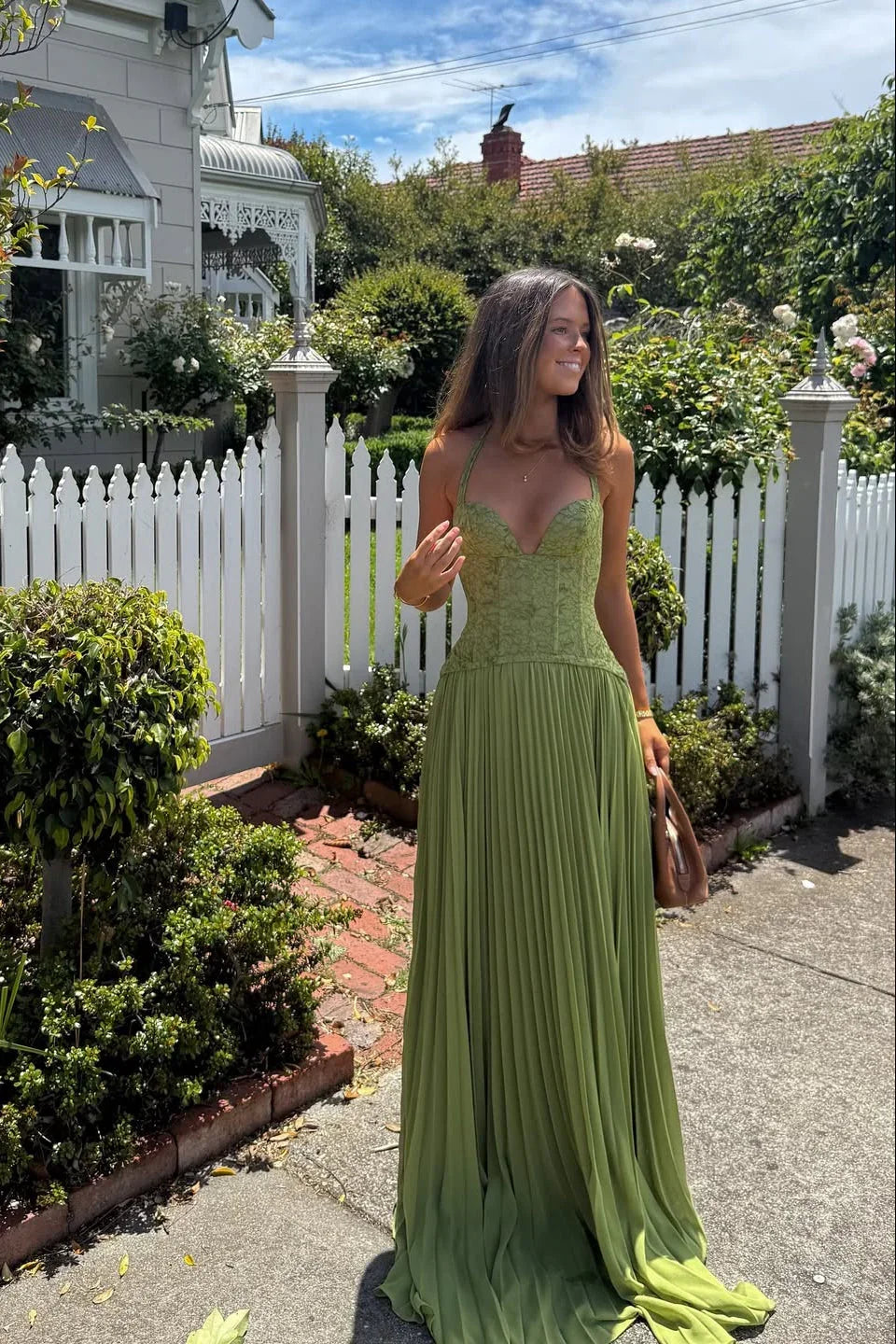 Green pleated maxi dress with fitted bodice