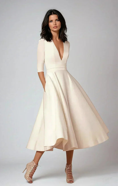 A-line wedding guest midi dress with three-quarter sleeves