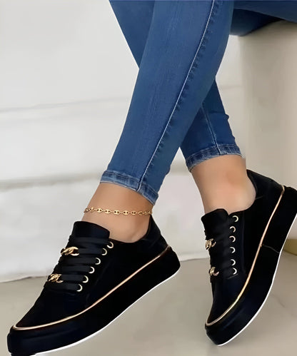 Lace-up platform sneakers with chain details, front view